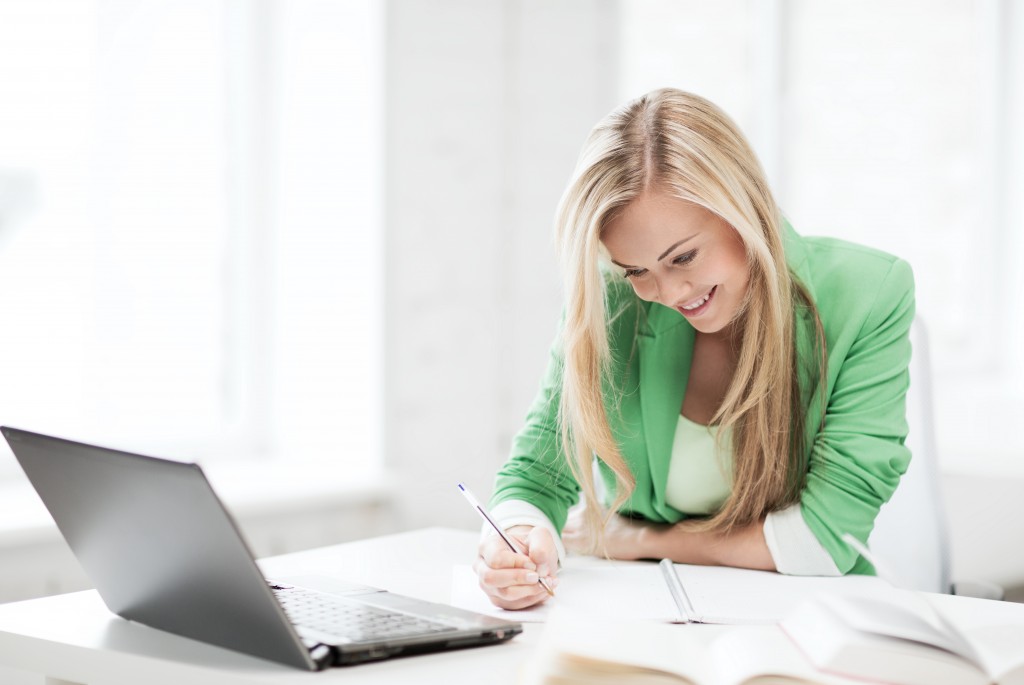 woman smiling while working