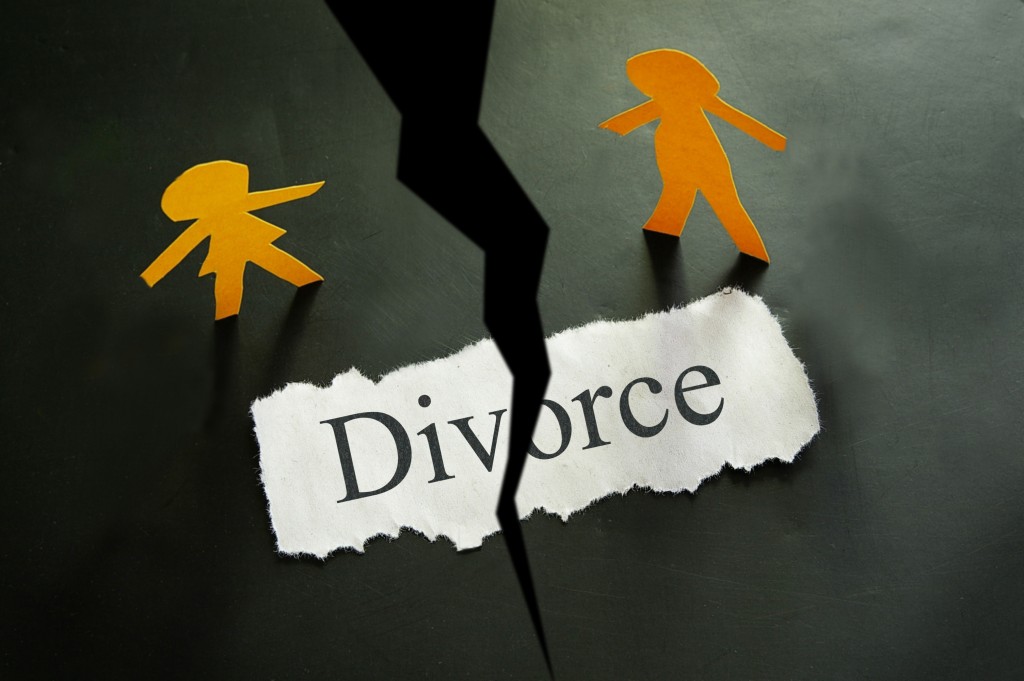 divorce concept on torn paper