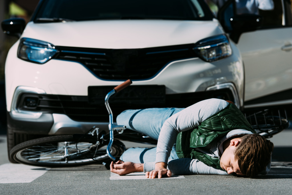 white sedan had hit a teenager crossing a pedestrian lane in a bike