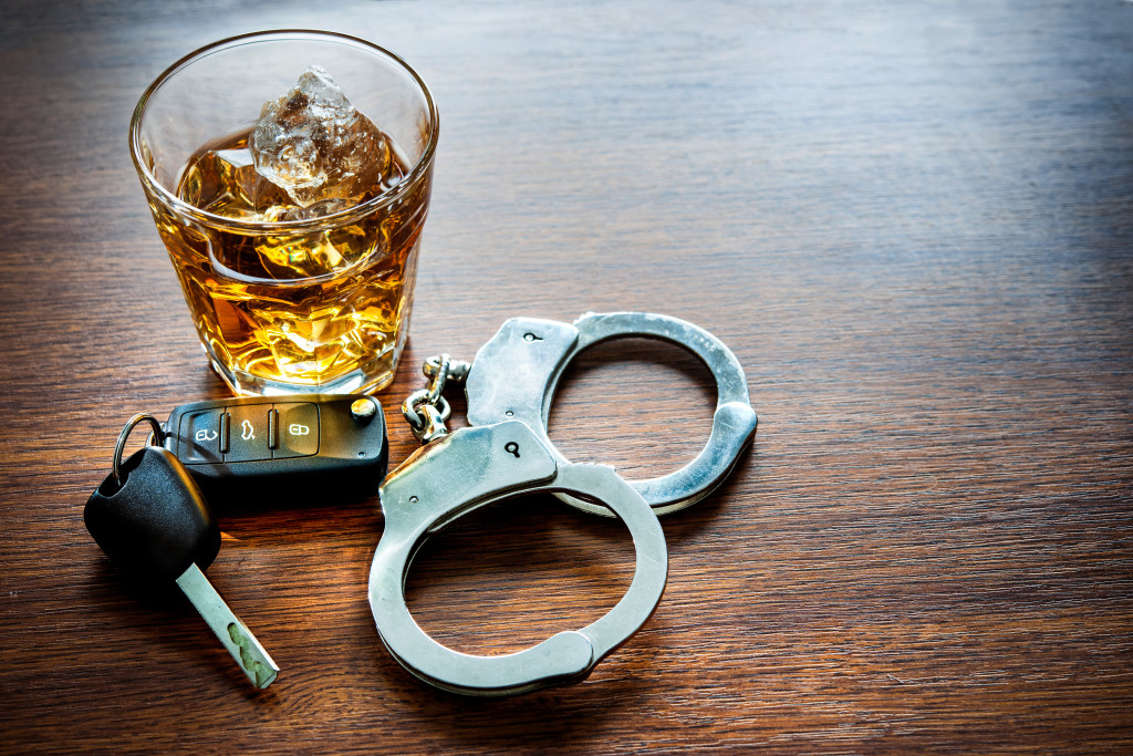 alcohol, handcuffs and keys