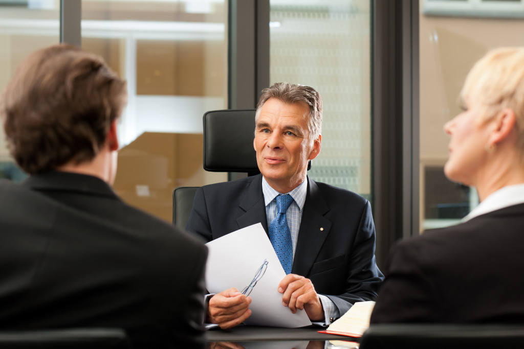 attorney discussing with business owners