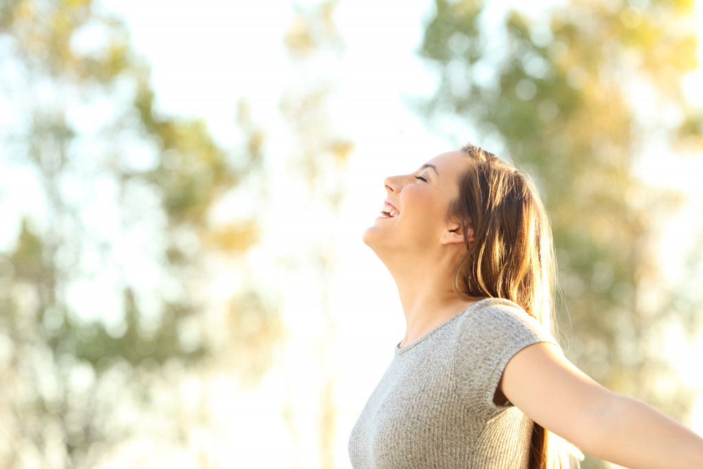 happy woman breaking free outdoor